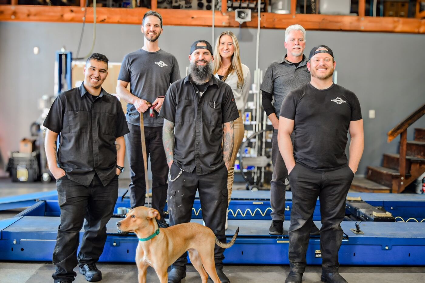The Hughes Automotive Center team standing together in the shop
